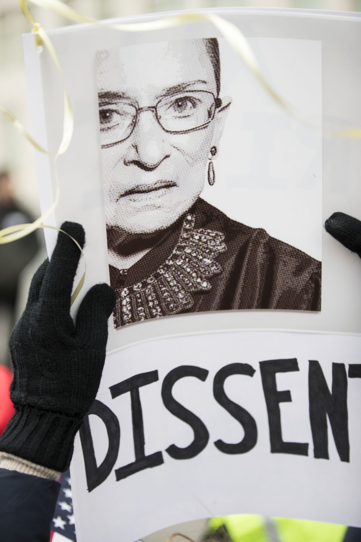 A protest sign with a picture of Ruth Bader Ginsburg