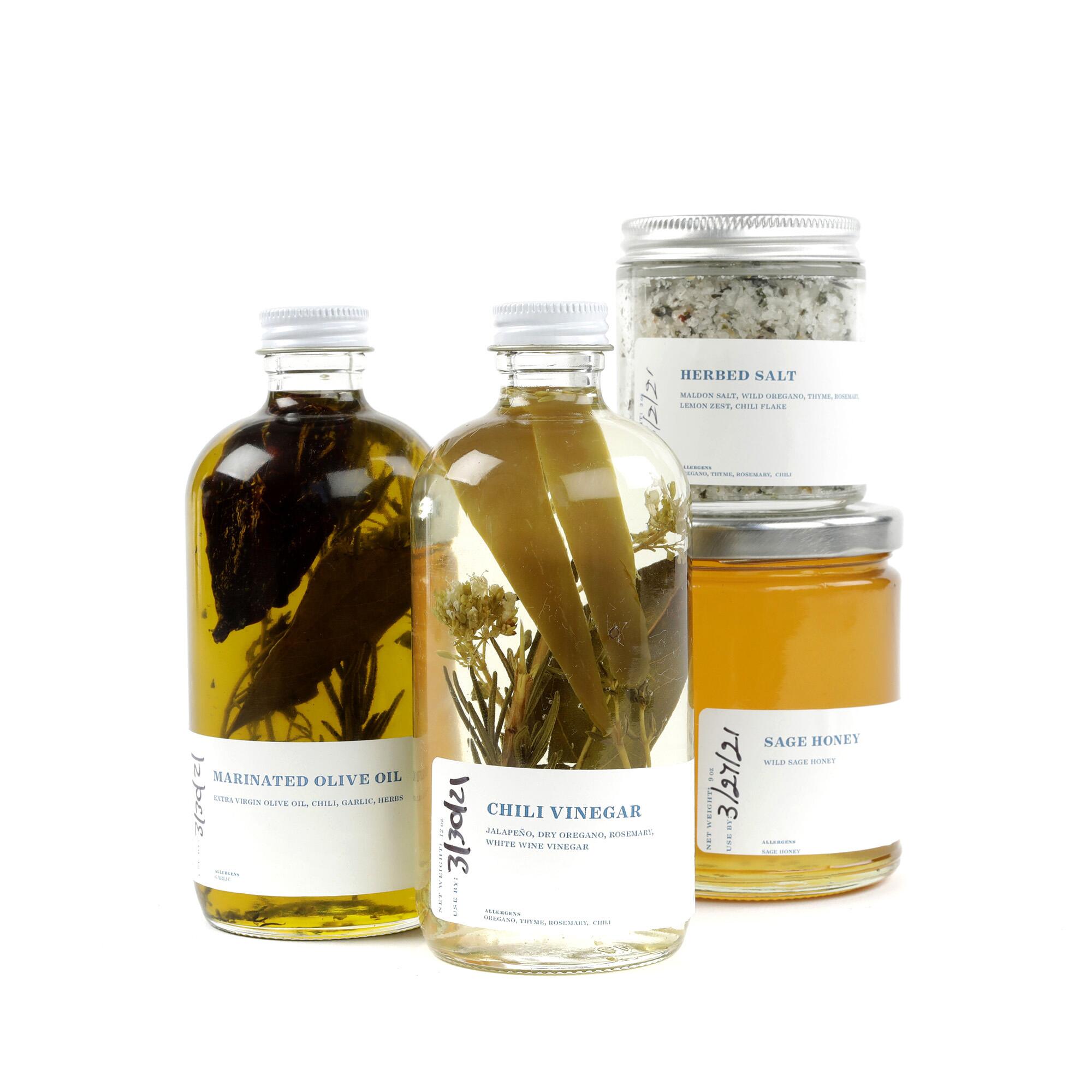 This gift box includes marinated olive oil, herbed salt, California sage honey and chili vinegar.