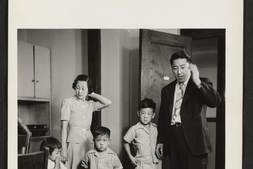 Mr. and Mrs. Oshima and their three small children, all recently arrived from the Tule Lake Relocation Center