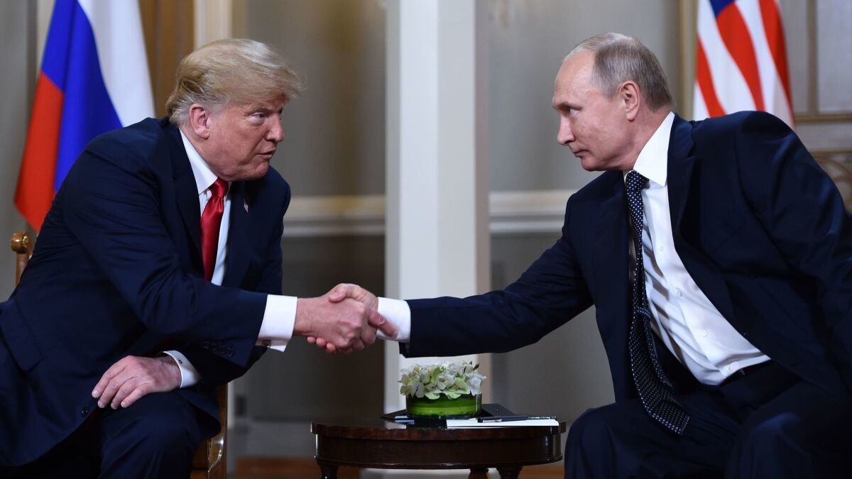 President Trump and Russian President Vladimir Putin shake hands before their meeting in Helsinki, Finland, on July 16.
