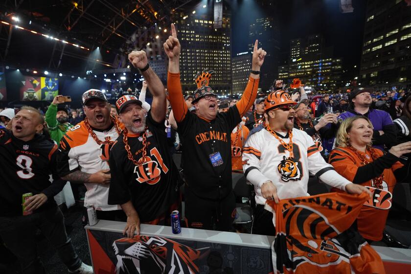 Cincinnati Bengals fans cheer during the first round of the NFL football draft, Thursday, April 25, 2024, in Detroit. (AP Photo/Paul Sancya)