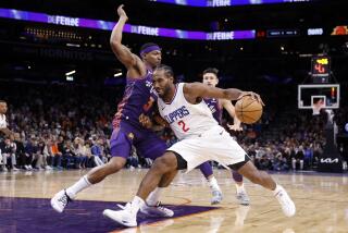 PHOENIX, ARIZONA - JANUARY 03: Kawhi Leonard #2 of the Los Angeles Clippers drives against Bradley Beal #3 of the Phoenix Suns during the second half at Footprint Center on January 03, 2024 in Phoenix, Arizona. NOTE TO USER: User expressly acknowledges and agrees that, by downloading and or using this photograph, User is consenting to the terms and conditions of the Getty Images License Agreement. (Photo by Chris Coduto/Getty Images)