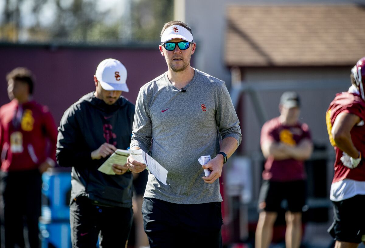 USC football coach Lincoln Riley instructs players during a spring football practice in March.