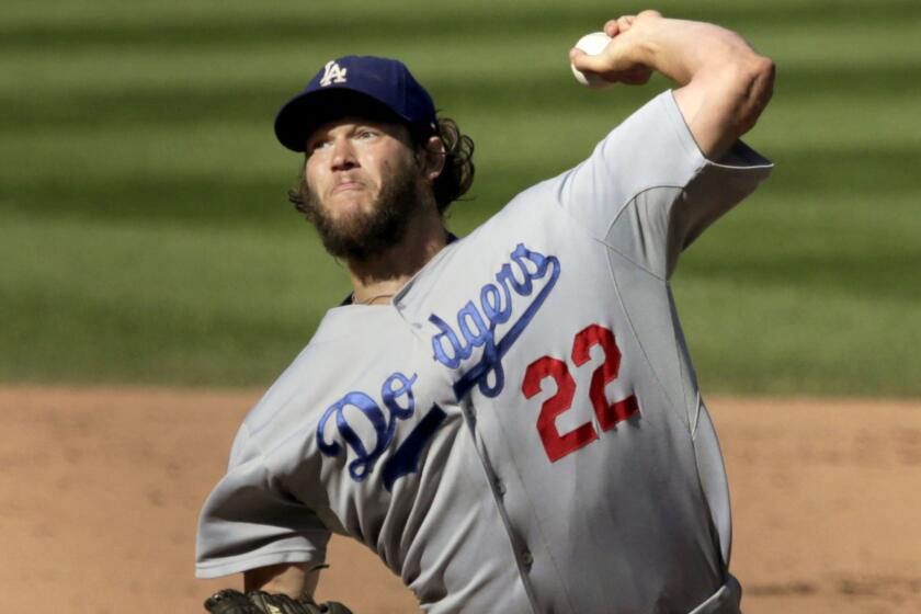 Dodgers starter Clayton Kershaw delivers a pitch during a game against the Chicago Cubs on Sept. 19, 2014.