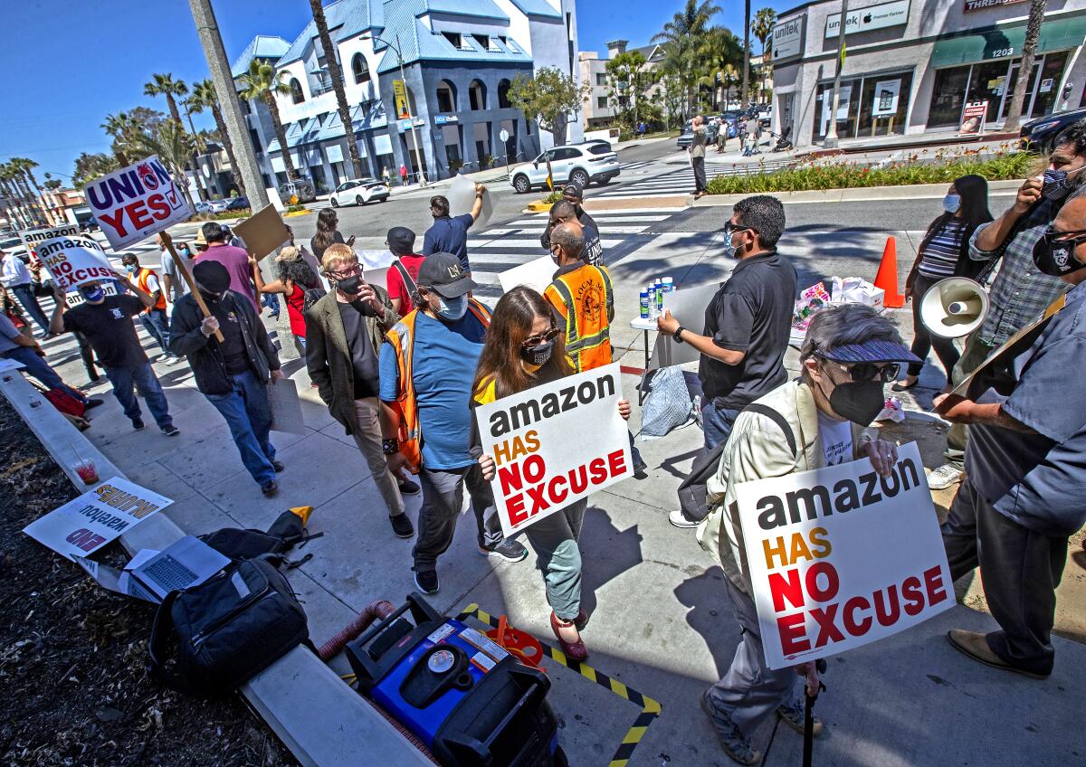Supporters of Amazon workers protest outside Fidelity Investments in Santa Monica. 