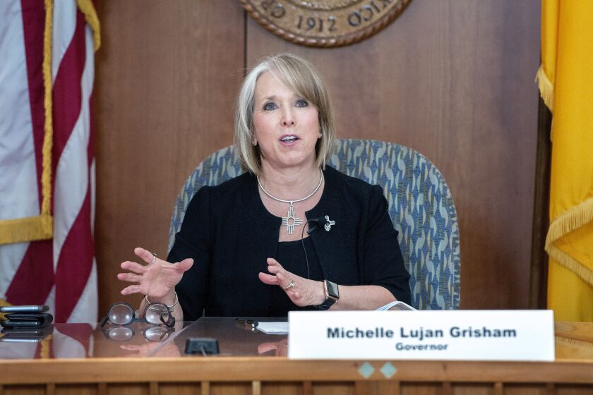 New Mexico Gov. Michelle Lujan Grisham gives an update on the COVID-19 outbreak in the state during a news conference in the state Capitol in Santa Fe, N.M., Wednesday, April 15, 2020. (Eddie Moore/The Albuquerque Journal via AP, Pool)