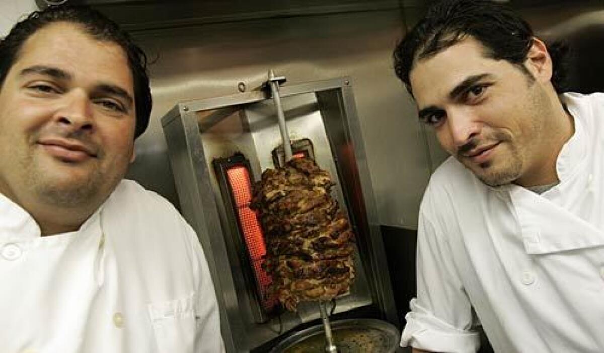 Bar-B-Kosher is owned and operated by the Dahan brothers, David, left, and Assi.