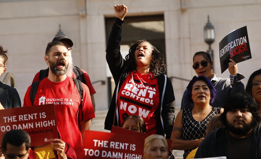Tenants and their advocates hold a press conference before the L.A City Council voted to move forward with an eviction moratorium.