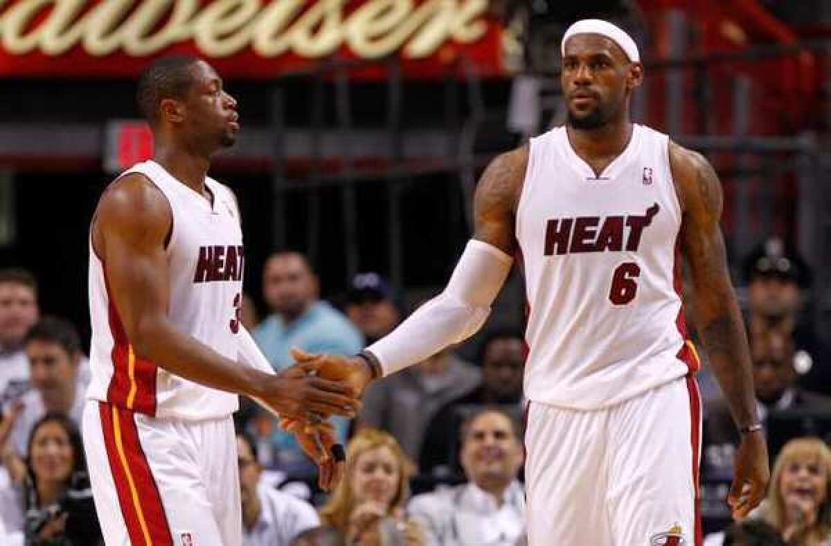 The Miami Heat's Dwyane Wade, left, and LeBron James on the road to a championship in May.