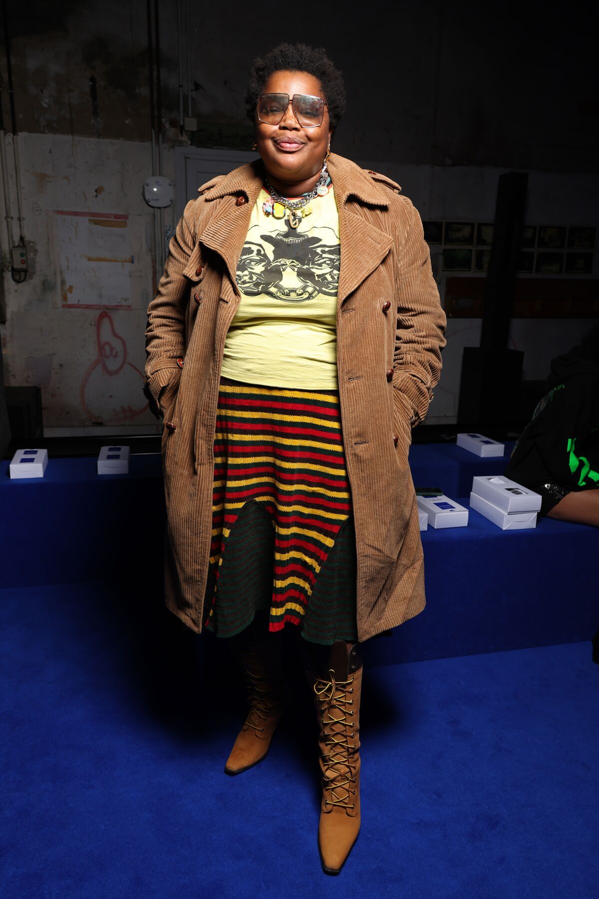 A woman poses in a nontraditional combination of clothing items during Paris Fashion Week.