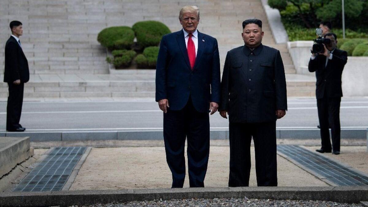 President Trump and North Korean leader Kim Jong Un stand on North Korean soil during their meeting in the demilitarized zone between North and South Korea on June 30, 2019.
