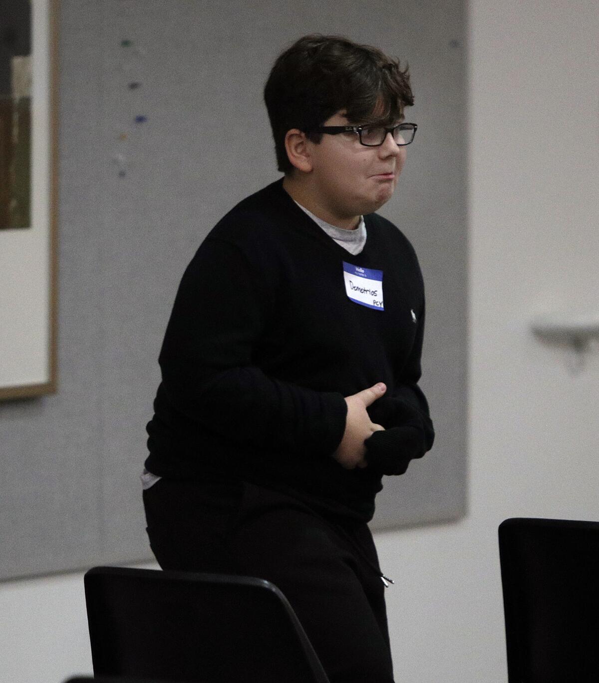 Paradise Canyon's Demetrios Pitsos looks a little stressed returning to his chair after spelling a word correctly in the LCUSD district spelling bee Monday. The fourth-grader placed second among 16 contestants.