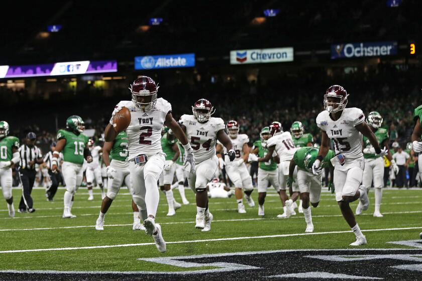 Troy wide receiver John Johnson (2) crosses into the end zone for a touchdown in the second half of the New Orleans Bowl NCAA college football game against North Texas in New Orleans, Saturday, Dec. 16, 2017. (AP Photo/Gerald Herbert)