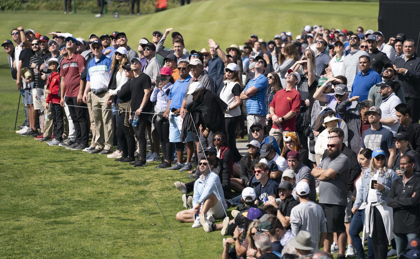 The gallery watches a drive by Tiger Woods on the sixth hole during the third round of the Genesis Invitational at Riviera Country Club on Feb. 15, 2020.