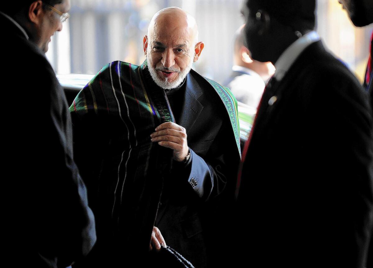 Afghan President Hamid Karzai arrives for a news conference March 6 in Colombo, the capital of Sri Lanka. Karzai is in Sri Lanka for a two-day official visit.