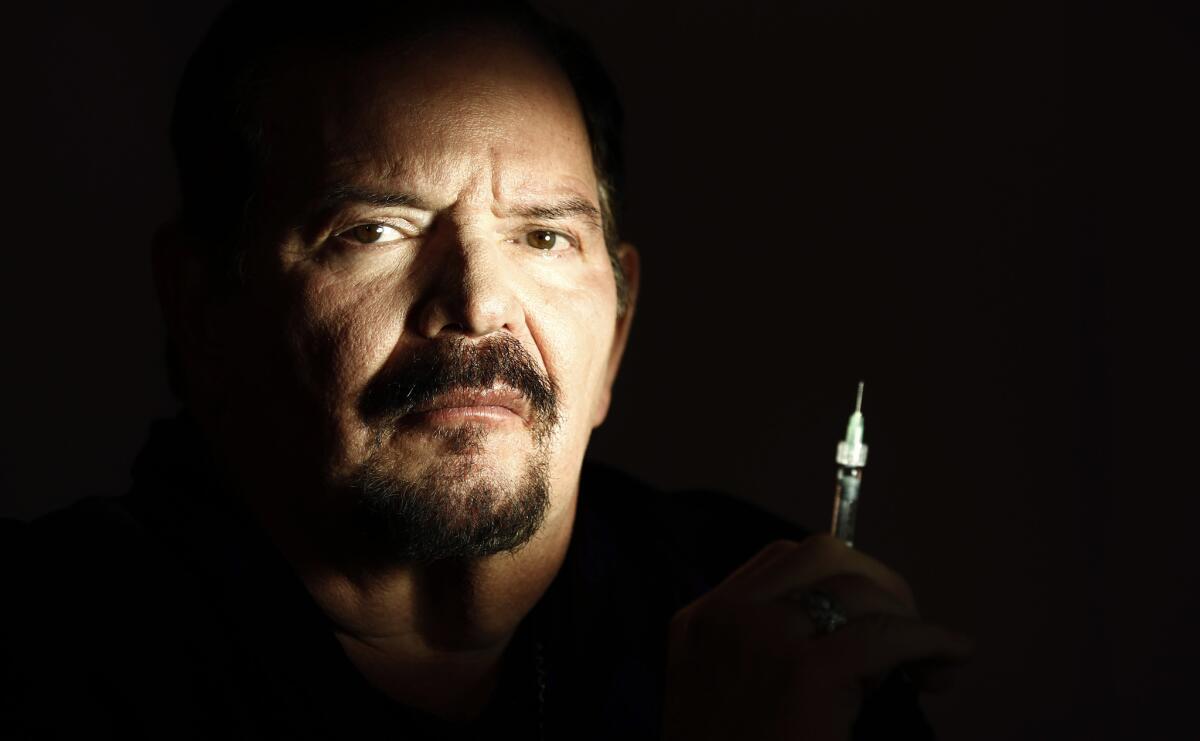 Dermatologist Arnold Klein poses for a portrait in his Beverly Hills office in 2011. Stars Elizabeth Taylor and Michael Jackson were among his patients.