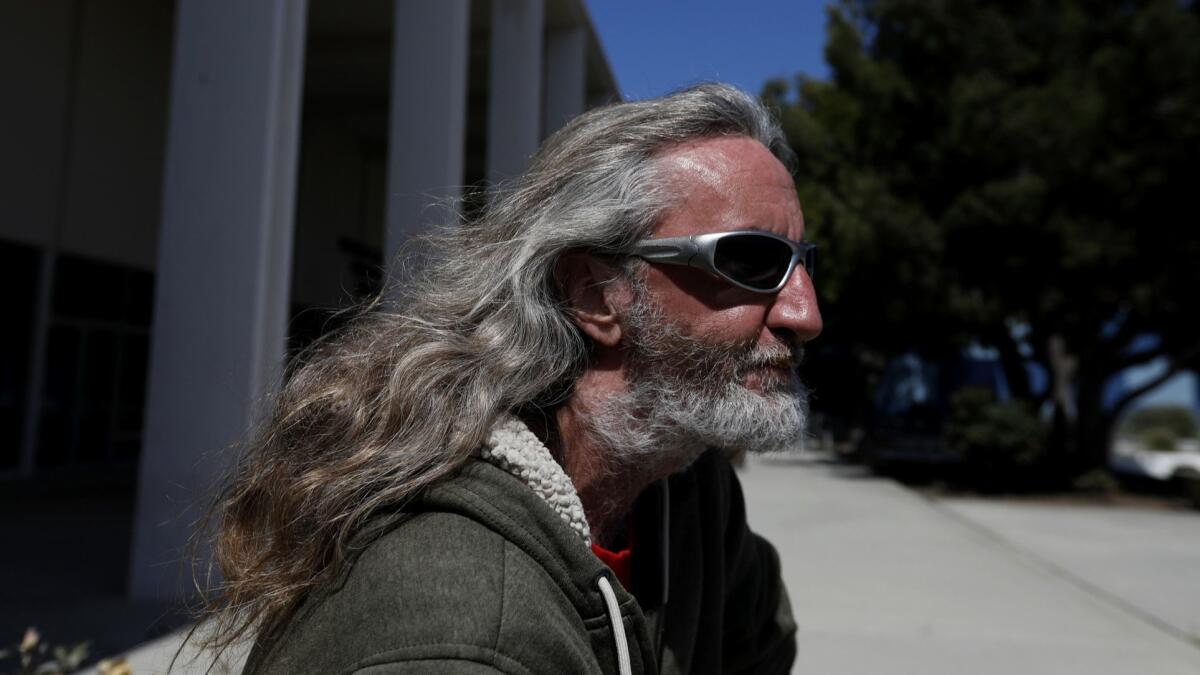 Bill Witter, 45, sits outside the old Malibu Courthouse and library on May 15.