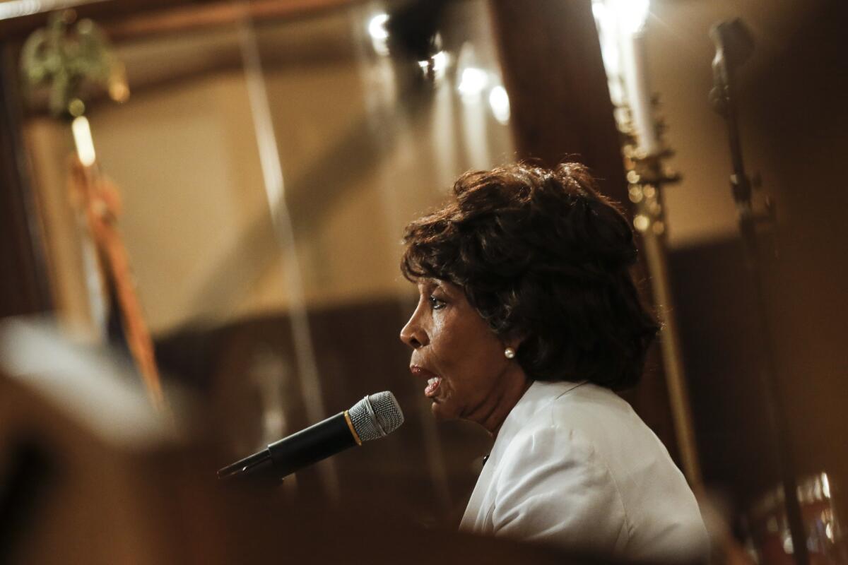 Rep. Maxine Waters (D-Los Angeles) speaks at a funeral in L.A. on Aug. 30.