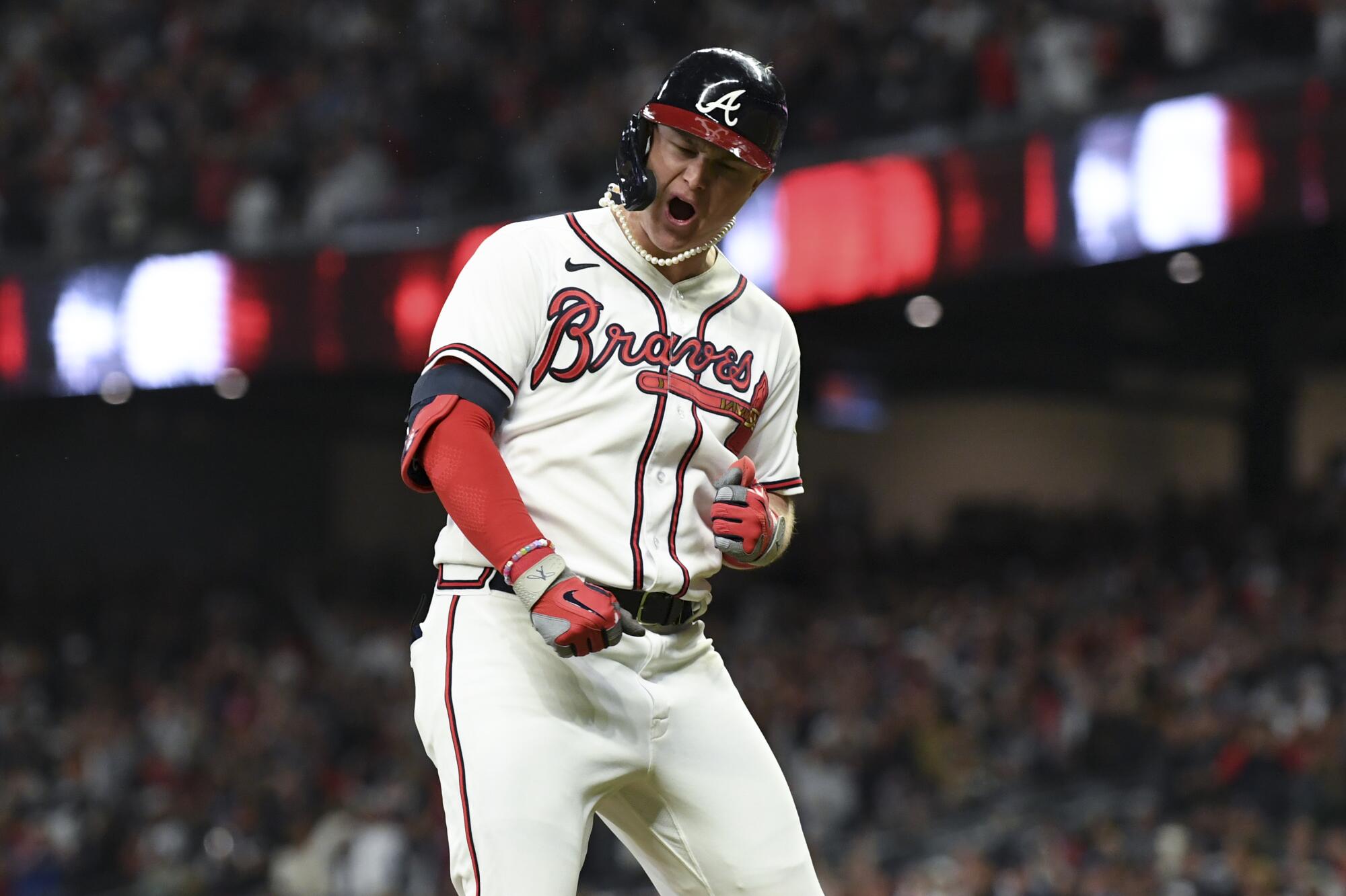 Atlanta, GA - October 17: Atlanta Braves' Joc Pederson celebrates while rounding the bases off a two-run.