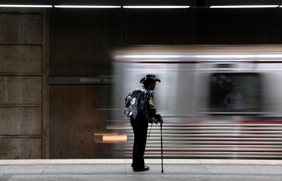 A Metro subway train rushes past a platform on Wednesday.