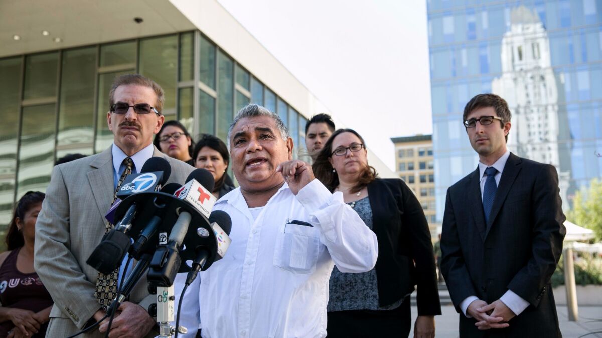 Aureliano Santiago, a street vendor, answers questions from reporters during a 2015 news conference about a lawsuit filed against the city of Los Angeles. Santiago was a plaintiff in the case.