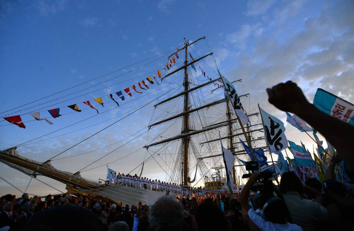 Government supporters attend the arrival of Argentina's frigate Libertad. The ship had been held for two months in Ghana during an attempted seizure by the head of a New York hedge fund.
