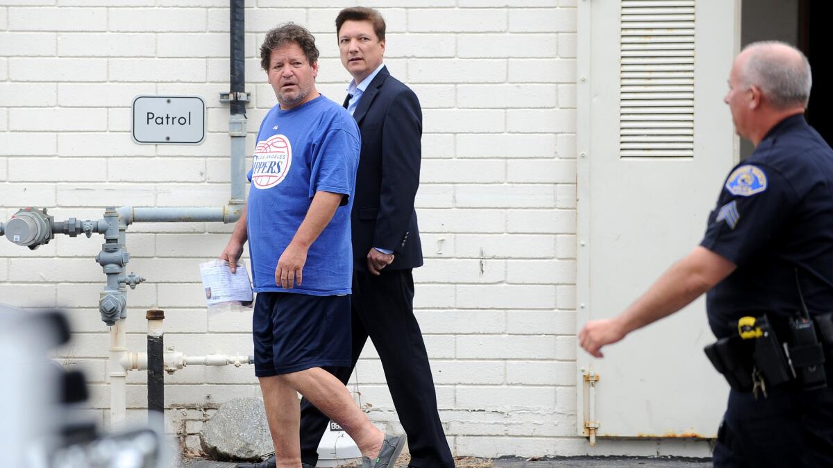 Roger Clinton, left, is released from jail after being arrested on suspicion of driving under the influence in Redondo Beach in June.