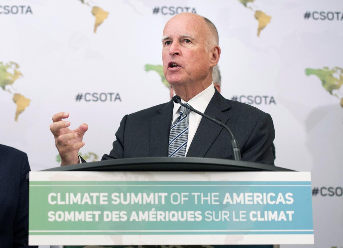 Gov. Jerry Brown speaks to reporters at the Climate Summit of the Americas in Toronto on July 8.