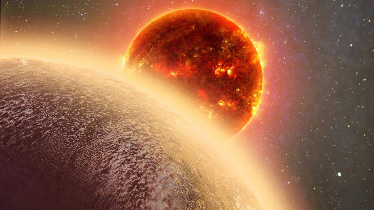 This artist’s conception made by Dana Berry of SkyWorks and provided by NASA on Nov. 6 shows GJ 1132b, front, a rocky planet similar to the Earth in size and mass, orbiting a red dwarf star.
