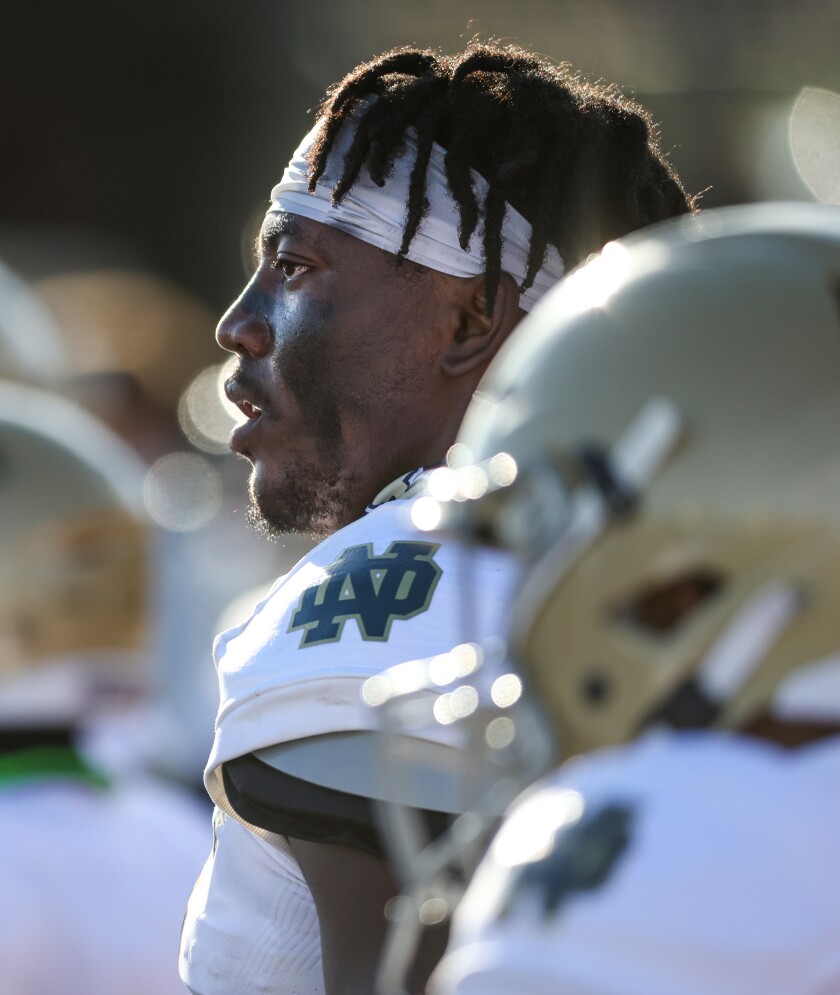 Sulayman Adeoye watches from the sideline as Notre Dame takes on Bishop Alemany.