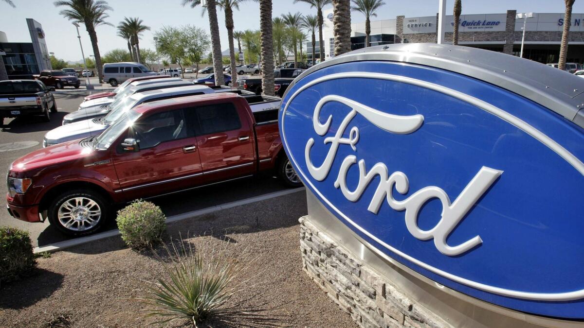 Ford F-150 trucks at a Gilbert, Ariz., dealership in March 2011.