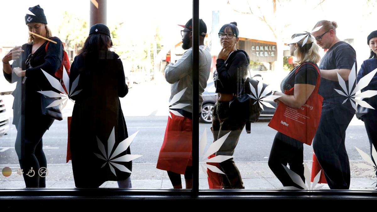 Customers line up outside MedMen in West Hollywood on Tuesday. Marijuana dispensaries in San Francisco have now also begun selling recreational pot.