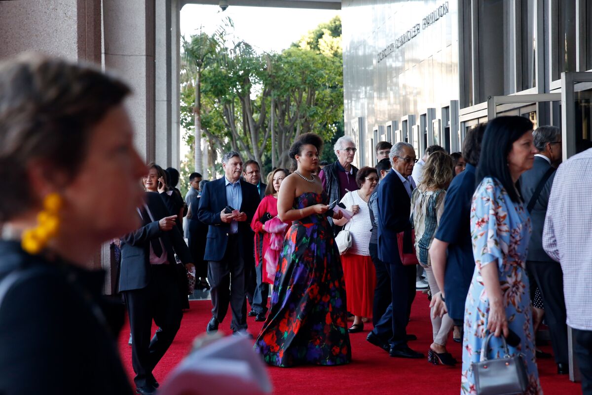 Los Angeles Opera patrons enter the Dorothy Chandler Pavilion on opening night Sept. 14. No protests, and no mention of Placido Domingo in the ball afterward.