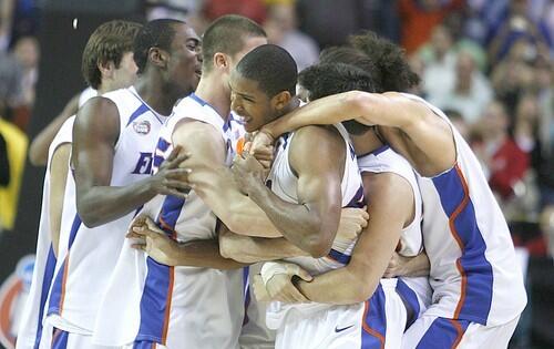 Florida players celebrate after defeating Ohio St. in the NCAA Championship in Atlanta Monday.