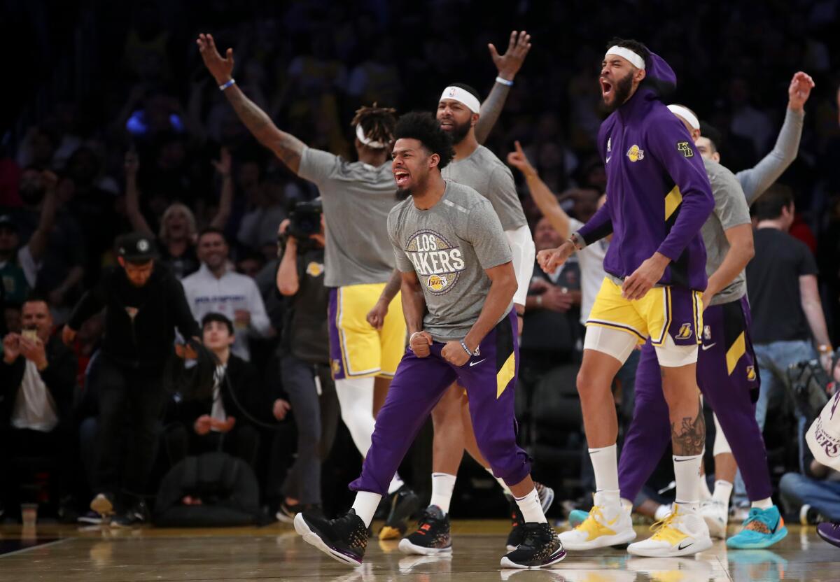 The Lakers bench reacts to a play during a game against the Philadelphia 76ers on March 3 at Staples Center.