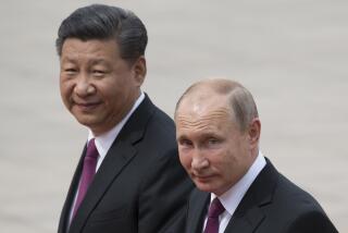 FILE - In this June 8, 2018, file photo, Russian President Vladimir Putin, right, and Chinese President Xi Jinping walk together during a welcome ceremony outside the Great Hall of the People in Beijing, China. If Donald Trump is serious about his public courtship of Vladimir Putin, he may want to take pointers from one of the Russian leader's longtime suitors: Chinese President Xi Jinping. In this political love triangle, Putin and Xi are tied by strategic need and a rare dose of personal affection, while Trump's effusive display in Helsinki showed him as an earnest admirer of the man leading a country long considered America's adversary. (AP Photo/Alexander Zemlianichenko, File)