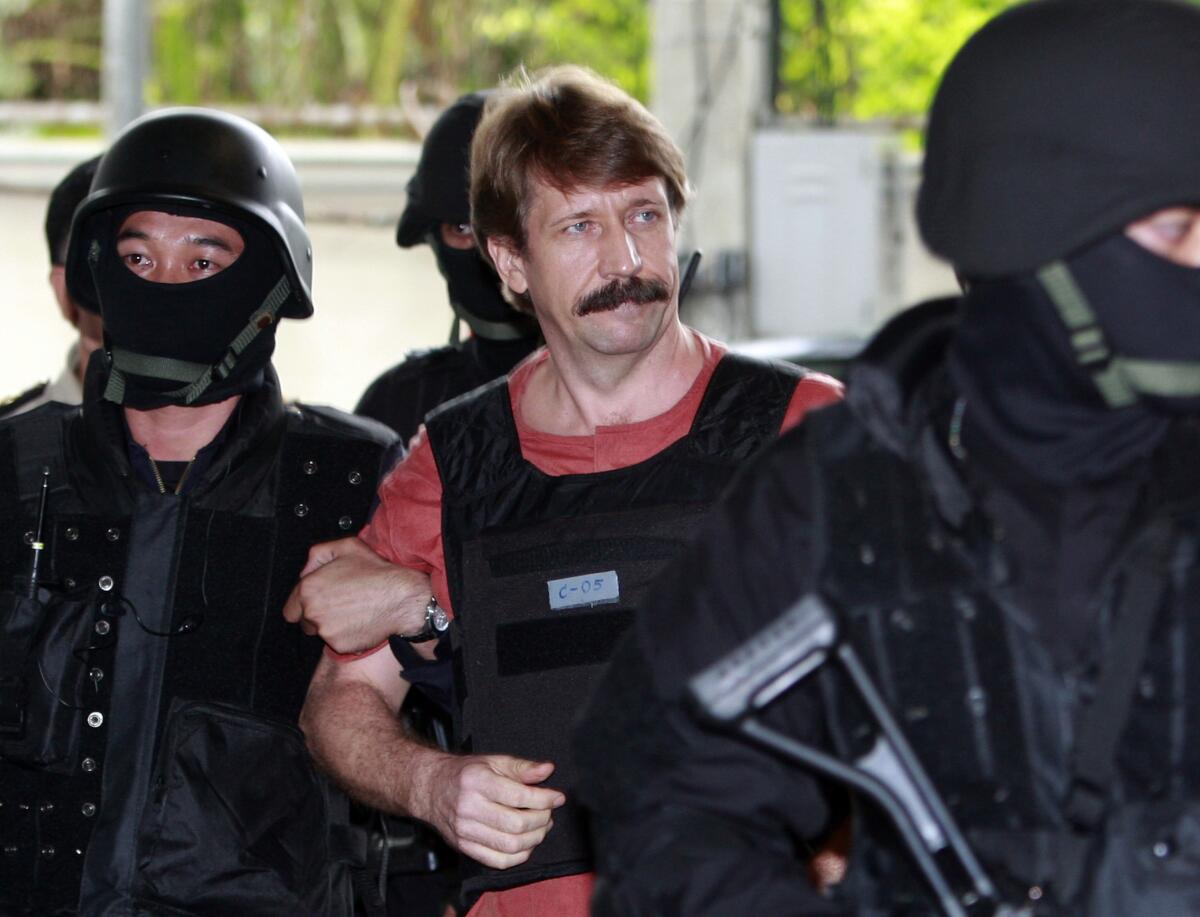 Viktor Bout, a Russian arms dealer once labeled the “Merchant of Death,” is escorted to a courtroom in Bangkok in 2010.