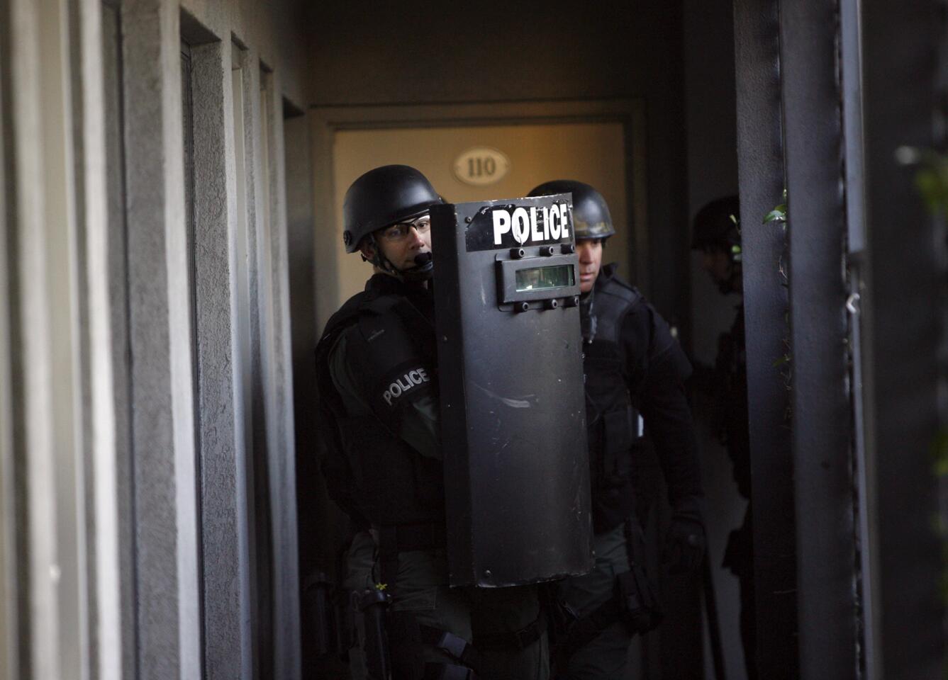 Members of the Glendale Police Dept. SWAT team search for mock suspect during training exercises at the now-closed Golden Key Hotel in Glendale on Thursday, January 19, 2012. The GPD and Glendale Fire Dept. are staging training exercises in the empty building before it is demolished.