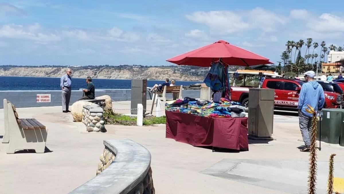 A vendor sets up shop at Children’s Pool Plaza in La Jolla in 2019.