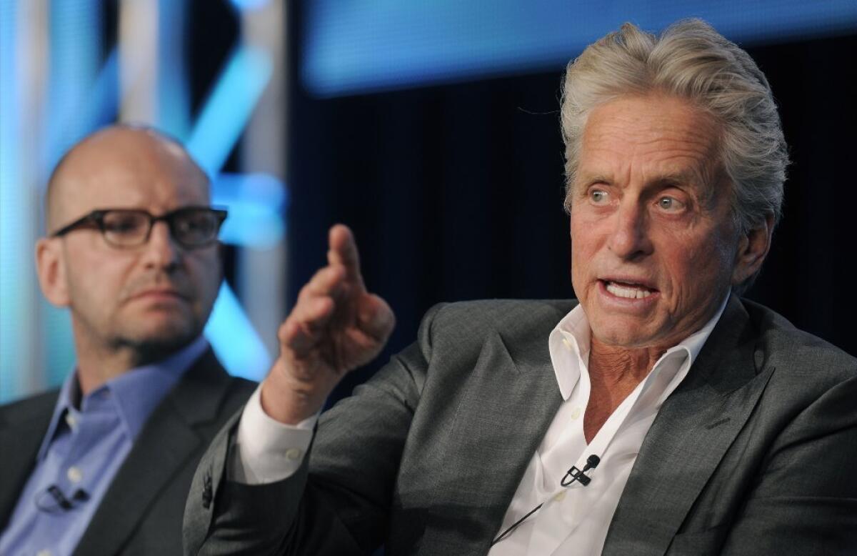 Michael Douglas, right, and Steven Soderbergh discuss the film "Behind the Candelabra" with the press this week.