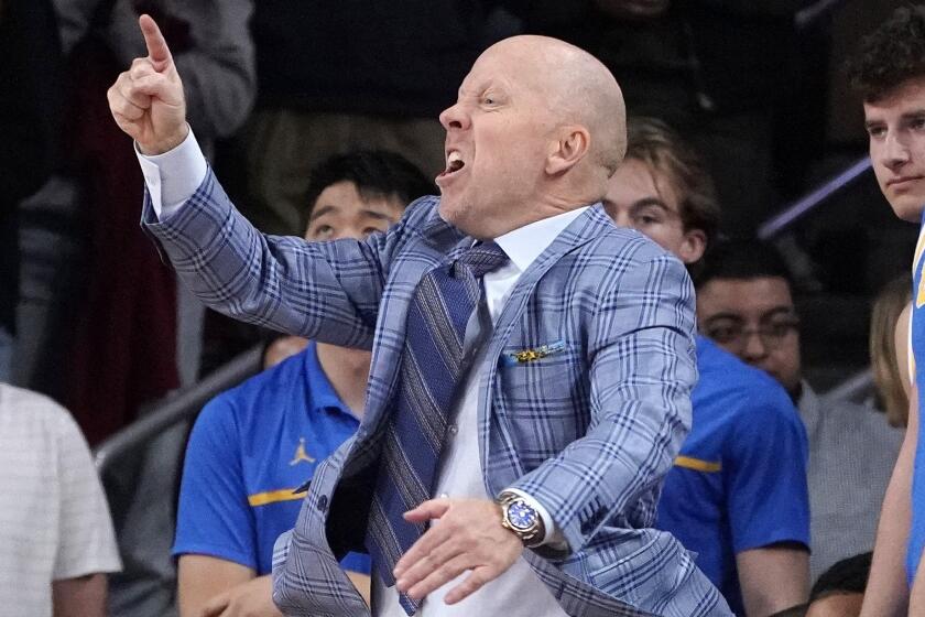 UCLA head coach Mick Cronin gestures to head team during the second half.