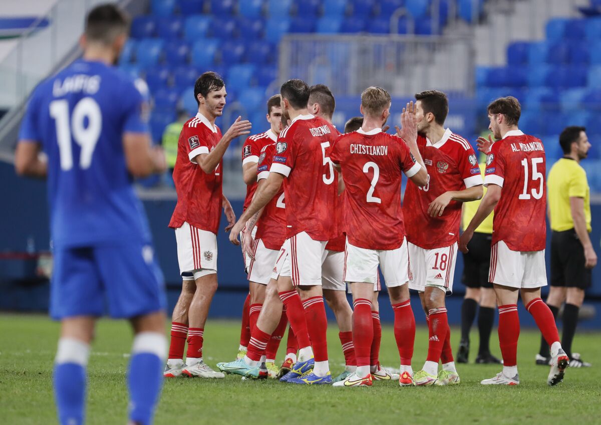 Russia's players celebrate their 6-0 victory in the World Cup 2022 group H qualifying soccer match between Russia and Cyprus at the Gazprom Arena in St. Petersburg, Russia, Thursday, Nov. 11, 2021. (AP Photo)