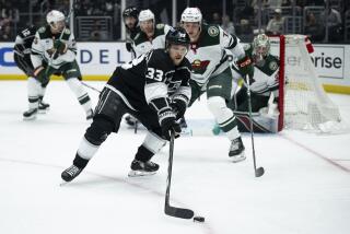 Los Angeles Kings right wing Viktor Arvidsson (33) reaches for the puck during the second period of an NHL hockey game against the Minnesota Wild, Monday, April 15, 2024, in Los Angeles. (AP Photo/Kyusung Gong)