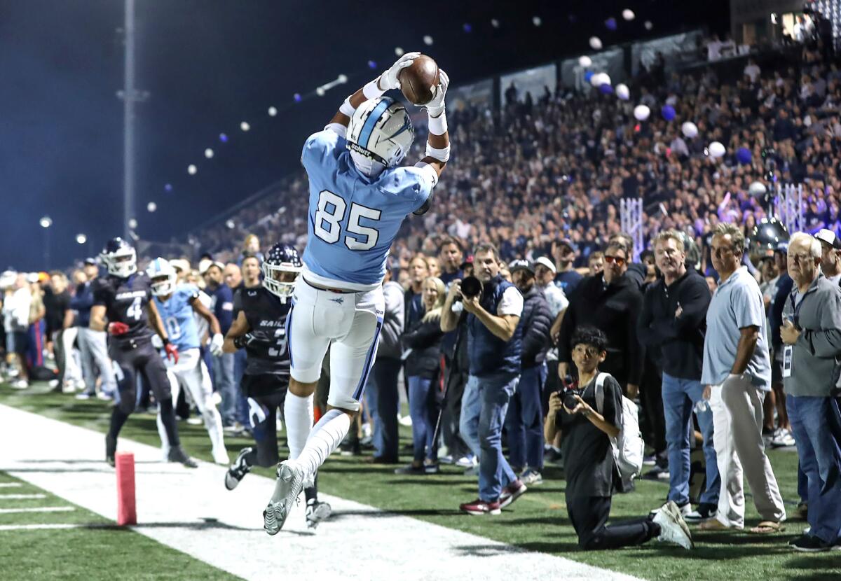 Corona del Mar tight end Sebastien Boydell makes an acrobatic catch deep in the corner of the end zone on Friday.