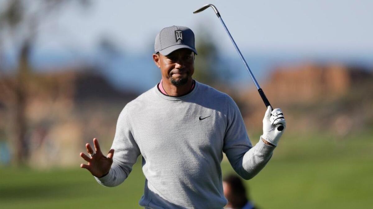 Tiger Woods reacts after hitting out of the rough on the ninth hole of the North Course during the second round of the Farmers Insurance Open on Jan. 27.