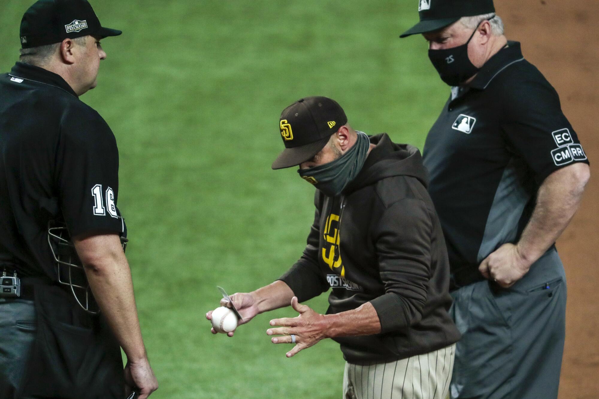 San Diego Padres manager Jayce Tingler argues with home plate umpire Lance Barrett.