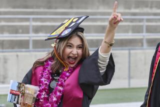 A student cheers during their commencement ceremony at Southwestern College on Friday, May 27, 2022 in Chula Vista, CA.
