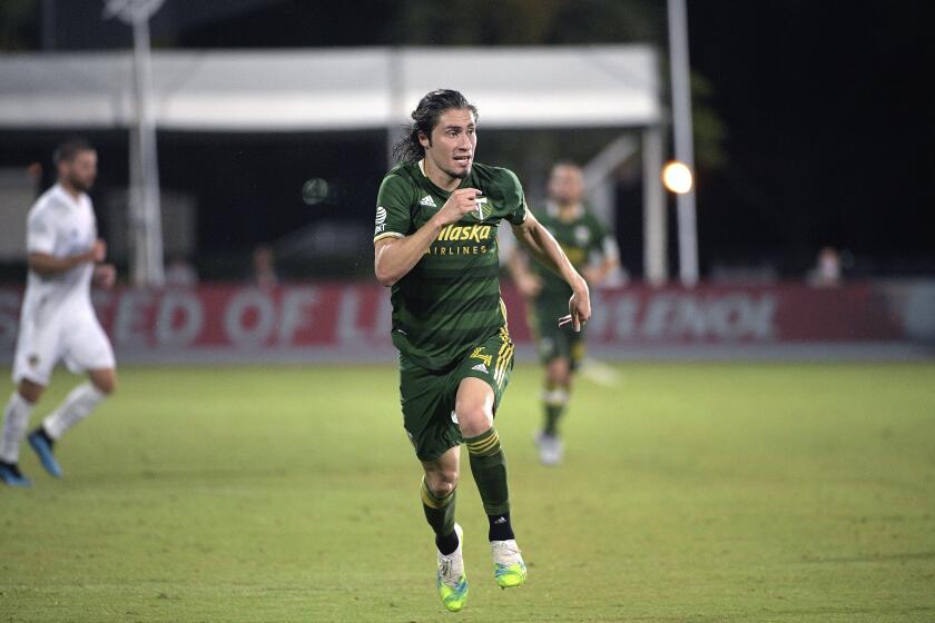 Portland Timbers defender Jorge Villafana (4) follows a play during the second half of an MLS soccer match against the LA Galaxy, Monday, July 13, 2020, in Kissimmee, Fla. (AP Photo/Phelan M. Ebenhack)