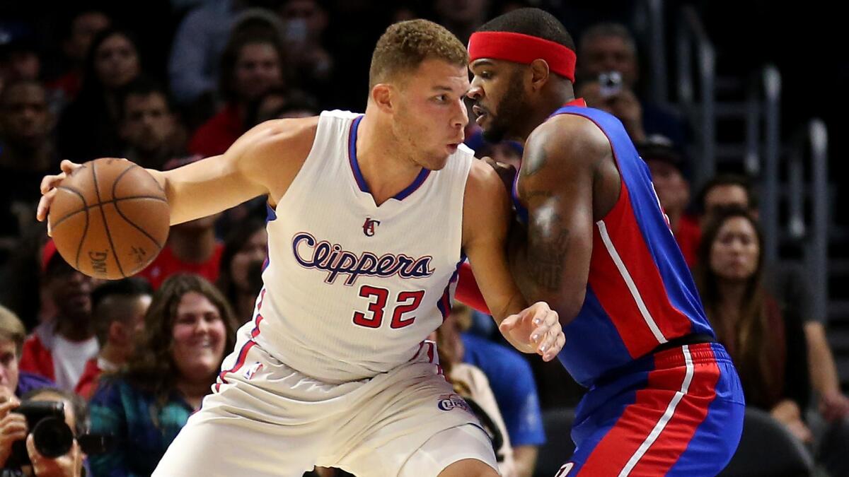 Clippers power forward Blake Griffin, left, tries to work past Detroit Pistons forward Josh Smith during the the Clippers' 113-91 win at Staples Center on Monday.