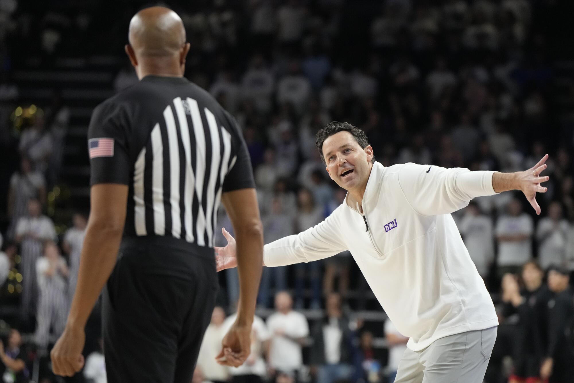Grand Canyon coach Bryce Drew talks to an official during the first half.